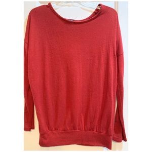 Red sweater. Cinched at the bottom